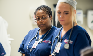 Two nursing students working together